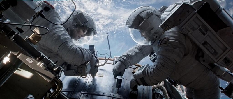 Sandra Bullock and George Clooney in Gravity (2013) Movie Image